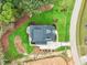 Aerial view of a modern home showing landscaping, driveway, and surrounding land at 1621 Legacy Ridge Ln, Wake Forest, NC 27587
