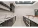 Beautiful bar area with white marble countertops and black cabinets offers abundant storage at 1621 Legacy Ridge Ln, Wake Forest, NC 27587
