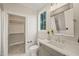 Bright bathroom features a gray vanity, tile floors, and a tub/shower combination at 1621 Legacy Ridge Ln, Wake Forest, NC 27587