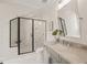 Bright bathroom with a glass shower, vanity and tile flooring at 1621 Legacy Ridge Ln, Wake Forest, NC 27587