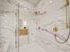 Elegant bathroom with gold accents, marble floors, and glass walk-in shower at 1621 Legacy Ridge Ln, Wake Forest, NC 27587