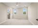 Bedroom featuring neutral carpet, two windows, recessed lighting, and an en suite bathroom at 1621 Legacy Ridge Ln, Wake Forest, NC 27587