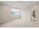 Bright bedroom with a ceiling fan and large window at 1621 Legacy Ridge Ln, Wake Forest, NC 27587