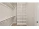 Walk in closet with custom shelving and hanging storage spaces at 1621 Legacy Ridge Ln, Wake Forest, NC 27587