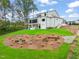 Expansive backyard features a screened porch, patio, lush lawn, and landscaped areas at 1621 Legacy Ridge Ln, Wake Forest, NC 27587
