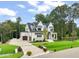 Attractive two-story home with a two-car garage, brick and stone accents, and a lush green lawn at 1621 Legacy Ridge Ln, Wake Forest, NC 27587