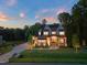 Expansive two-story home with well-manicured lawn, long driveway, and beautiful trees in a private and peaceful setting at 1621 Legacy Ridge Ln, Wake Forest, NC 27587