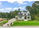 Attractive two-story home with a brick and stone facade, a two-car garage, and manicured landscaping at 1621 Legacy Ridge Ln, Wake Forest, NC 27587