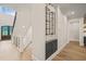 Hallway features wine storage and stairs leading to the second floor at 1621 Legacy Ridge Ln, Wake Forest, NC 27587