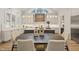 Bright kitchen showcases an eat-in island with stone countertops and modern decor at 1621 Legacy Ridge Ln, Wake Forest, NC 27587