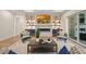 Inviting living room with fireplace, custom shelving, and comfortable seating at 1621 Legacy Ridge Ln, Wake Forest, NC 27587