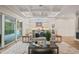 Open concept living area with wood floors, modern décor, and access to an outdoor patio at 1621 Legacy Ridge Ln, Wake Forest, NC 27587