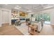 Cozy living room with wood floors, a fireplace, a TV, and access to an outdoor patio at 1621 Legacy Ridge Ln, Wake Forest, NC 27587