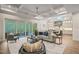 Open-concept living space with wood floors, backyard views, and seamless indoor-outdoor living at 1621 Legacy Ridge Ln, Wake Forest, NC 27587