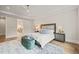 Comfortable main bedroom featuring soft lighting and a stylish accent rug and bench at 1621 Legacy Ridge Ln, Wake Forest, NC 27587