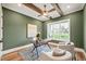 This home office features a ceiling fan, stylish rug, natural light, and hardwood floors at 1621 Legacy Ridge Ln, Wake Forest, NC 27587