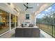 This covered outdoor space features a fireplace, comfortable seating, and a great view at 1621 Legacy Ridge Ln, Wake Forest, NC 27587