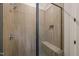 Modern shower features tile, a glass shower door, and a built in shower seat at 1621 Legacy Ridge Ln, Wake Forest, NC 27587