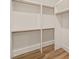 Spacious walk-in closet with custom shelving providing ample storage space at 1621 Legacy Ridge Ln, Wake Forest, NC 27587
