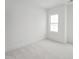 Well-lit bedroom with carpeting and a window, offering ample natural light at 814 Barlow Dr, Knightdale, NC 27545