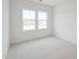 Bright bedroom with natural light from large windows, featuring neutral carpeting at 814 Barlow Dr, Knightdale, NC 27545