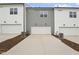 View of attached townhomes with a three-car garage and a shared driveway at 814 Barlow Dr, Knightdale, NC 27545