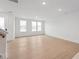 Bright living room area with hardwood floors and a view of the front yard at 814 Barlow Dr, Knightdale, NC 27545
