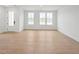 Bright living room area with hardwood floors and a view of the front yard at 814 Barlow Dr, Knightdale, NC 27545