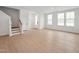 Bright living room area with hardwood floors and a staircase leading to the upper level at 814 Barlow Dr, Knightdale, NC 27545