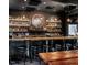 Rustic bar interior with extensive liquor selection and wooden bar top at 1505 Patchings Ln, Knightdale, NC 27545