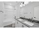 Double vanity bathroom with modern fixtures, shower, and plenty of storage at 1505 Patchings Ln, Knightdale, NC 27545