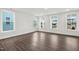 Bright and spacious bedroom with three large windows providing natural light and neighborhood views at 1505 Patchings Ln, Knightdale, NC 27545