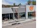 Modern commercial building exterior with ample parking and outdoor seating at 1505 Patchings Ln, Knightdale, NC 27545