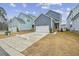 Two-story home with gray siding, two-car garage, and well-maintained lawn at 1505 Patchings Ln, Knightdale, NC 27545