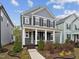 Inviting two-story home with a covered front porch and well-manicured landscaping at 1505 Patchings Ln, Knightdale, NC 27545