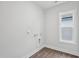 Bright laundry room with ample space for washer, dryer, and storage at 1505 Patchings Ln, Knightdale, NC 27545