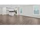 Spacious open-concept living area with modern kitchen and lots of natural light at 1505 Patchings Ln, Knightdale, NC 27545