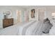 Comfortable main bedroom showing the ensuite bathroom entry, walk-in closet, and stylish decor at 1505 Patchings Ln, Knightdale, NC 27545