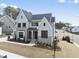 Attractive two-story home with light blue siding, black trim, and landscaping at 9400 Rawson Ave, Raleigh, NC 27613