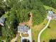 Aerial view of home with tree-lined lot featuring long driveway and lush backyard at 3691 Graham Sherron Rd, Wake Forest, NC 27587