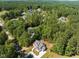 Aerial view of home surrounded by mature trees and lush greenery at 3691 Graham Sherron Rd, Wake Forest, NC 27587