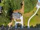 Expansive aerial view showcasing the home's architecture and driveway, surrounded by lush greenery and landscape at 3691 Graham Sherron Rd, Wake Forest, NC 27587