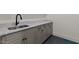 Basement bar area with black hardware and granite countertops at 3691 Graham Sherron Rd, Wake Forest, NC 27587