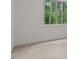 Bright bedroom featuring carpeted floors and a window offering a view of the outdoors at 3691 Graham Sherron Rd, Wake Forest, NC 27587
