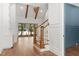 Bright foyer with hardwood floors leading to large sliding glass doors and open beams at 3691 Graham Sherron Rd, Wake Forest, NC 27587