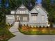 Charming home featuring stone accents, multiple windows, complemented by a professionally landscaped front yard at 3691 Graham Sherron Rd, Wake Forest, NC 27587