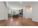 Bright, open kitchen with stainless steel appliances and an island with pendant lighting at 3691 Graham Sherron Rd, Wake Forest, NC 27587