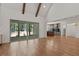 Spacious living area connecting kitchen and sunroom, featuring hardwood floors at 3691 Graham Sherron Rd, Wake Forest, NC 27587