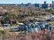 An aerial shot highlights the community's layout and surrounding greenery at 618 Velma Hopkins Ln, Raleigh, NC 27603