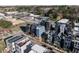 Stunning aerial view of modern townhomes with rooftop patios and lush landscaping at 618 Velma Hopkins Ln, Raleigh, NC 27603